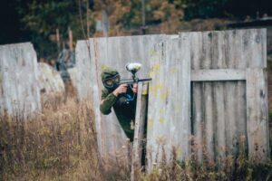 Man with gun playing at paintball