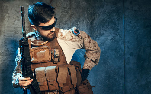 American private military contractor holding rifle