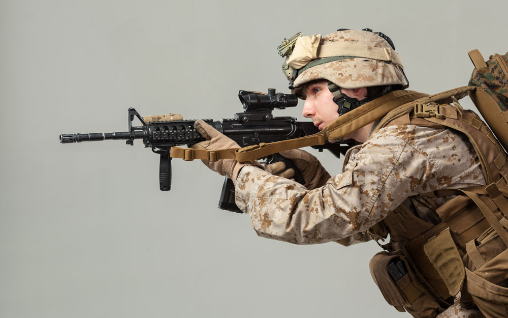 Rifleman camouflage holding rifle 
