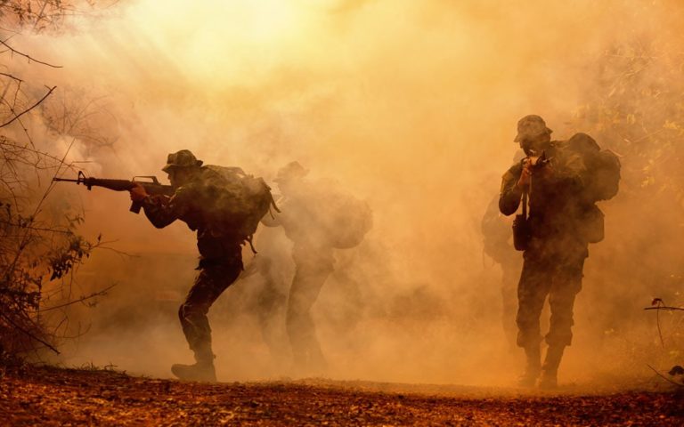 Military silhouettes in the battlefield.